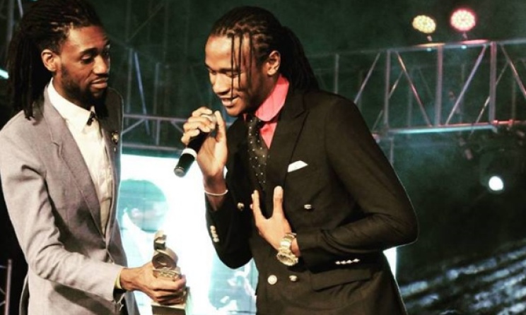 Jah Prayzah accepts one of his four ZIMA trophies from Tendai Manatsa. Photo: ZIMA/Facebook