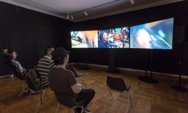 Audiences watch Philip Miller's sound installation 'BikoHausen' in Germany. Photo: Daniel Pafe / IMD