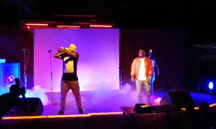 MI Abaga, right, looks on as Loose Kaynon performs. 