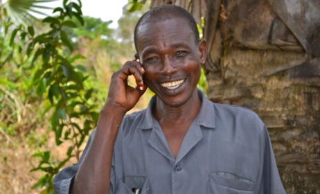 Phone user enjoying services. Photo: www.mercycorps.org.uk