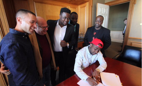 Davido signs with Sony Music.