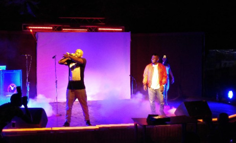 MI Abaga, right, looks on as Loose Kaynon performs. 