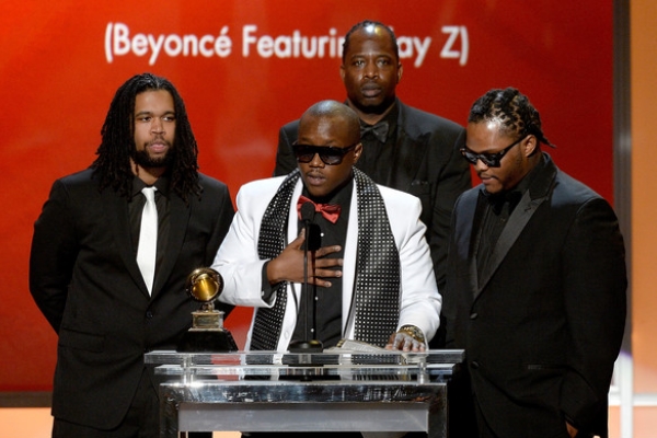 Brian Soko (in white) gives his Grammy acceptance speech.