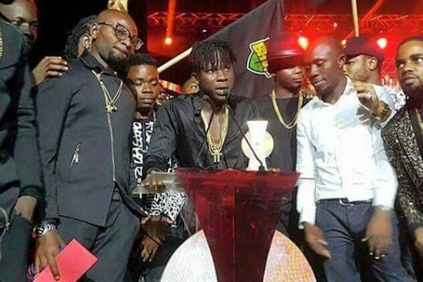 Stonebwoy accepts one of his three awards. Photo: Facebook