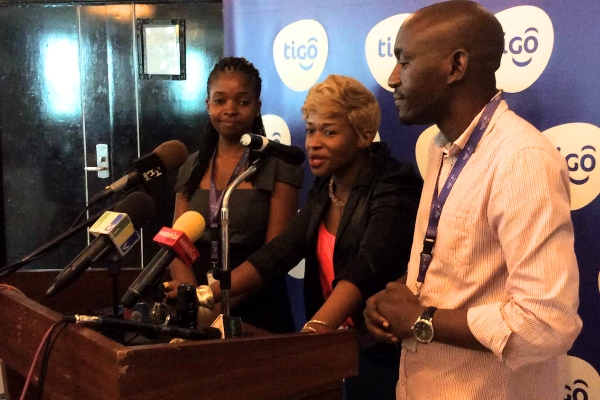 Musician Linah Sanga (centre) with Tigo representatives at the launch in Dar es Salaam in January. Photo: www.millicom.com