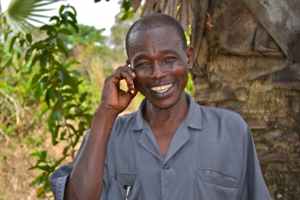 Phone user enjoying services. Photo: www.mercycorps.org.uk