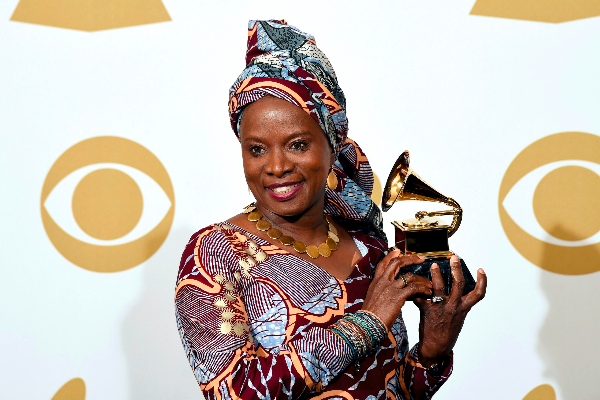 Angelique Kidjo with one of her three gilded gramophones. Photo: Grammy Awards