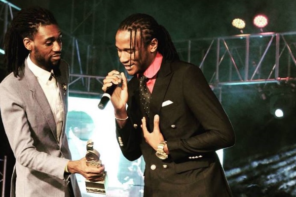 Jah Prayzah accepts one of his four ZIMA trophies from Tendai Manatsa. Photo: ZIMA/Facebook