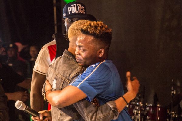 Olamide hugs headliner Reminisce. Photo: Clicks and Tones