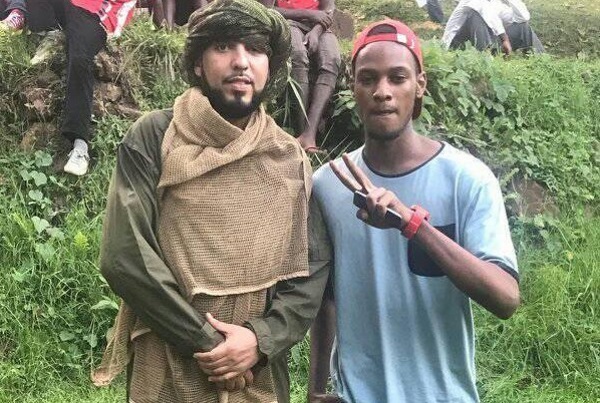 French Montana with a crew member on set in Uganda. Photo: Arnold Jethro/Facebook