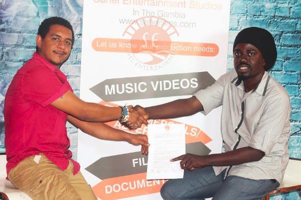 Photo from Nacif's official signing to Sahel Entertainment.