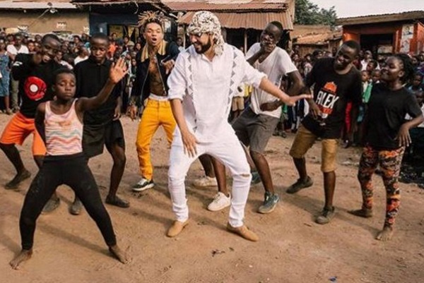 French Montana and Swae Lee dancing with the Triplets Ghetto Kids in Kampala. Photo: Kiss 100