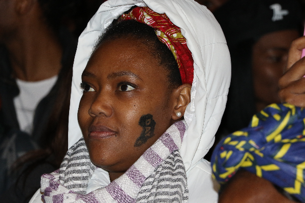 A fan watches an act during the Africa Day concert in Johannesburg on Saturday 27 May.