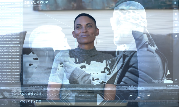 The Goapele android watching a video of her and her creator.