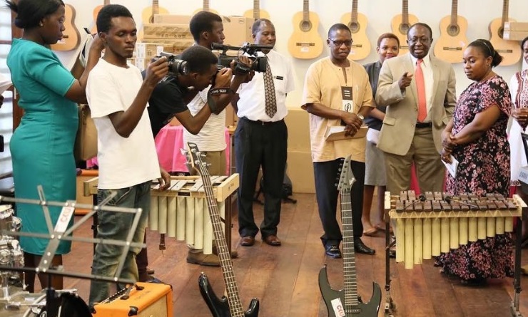 Tanzanian Minister of Information, Culture and Sports Harrison Mwakyembe (third from right) donates instruments to a music college in May 2017.