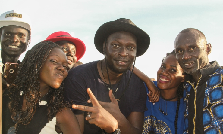 US-based South Sudanese musician Dynamq (middle) posses with fans at the Jere Jere concert.