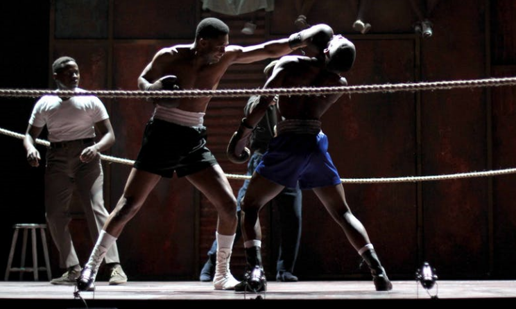 Andile Gumbi beats down his opponent Given Mkhize in the King Kong musical. Photo: John Hogg