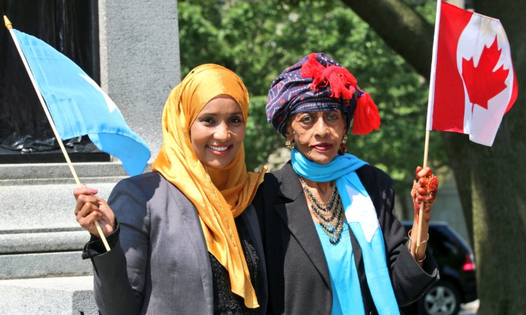 Integration TV founder Hodan Nalayeh, left, and Khadija Abdullahi Daleys holding the Somialian and Canadian flags. Photo: Twitter