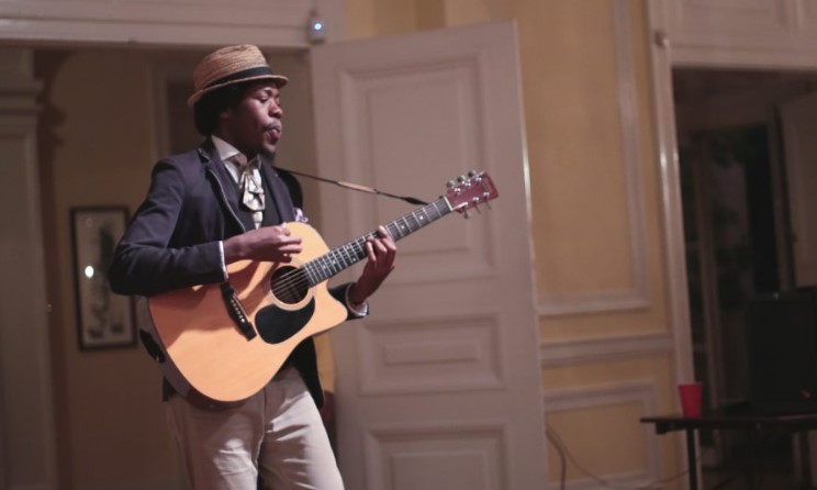A OneBeat fellow plays the guitar. Photo: OneBeat