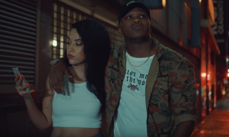 KLY taking a walk through Johannesburg CBD with his girlfriend and her cellphone in 'Patience'.