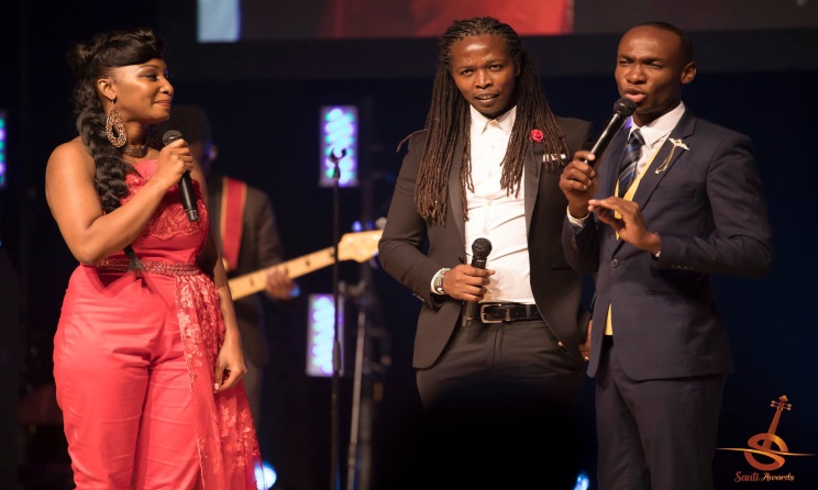 Jey Mbiru Center, Flanked by Sauti Awards 2017 host Ntambo and Dr Ofweneke. Photo : Facebook