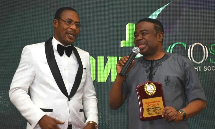 Tony Okoroji, right, receives a plaque at the 2018 COSON annual general meeting. Photo: COSON