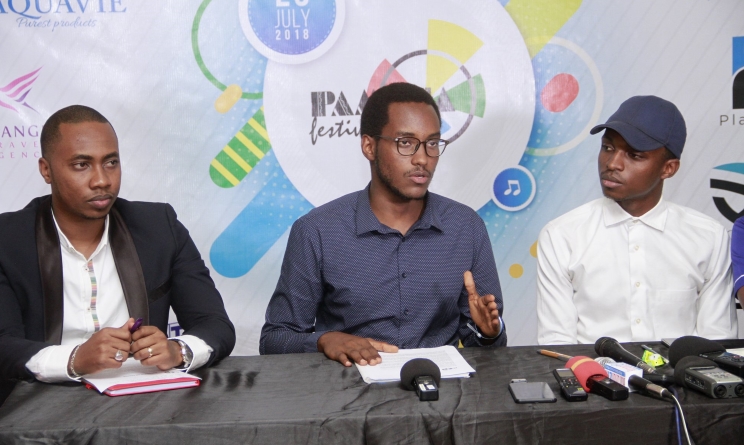Pamoja Festival assistant communications officer Hugues Safari, middle, addresses the media on Monday ahead of this year's Pamoja Festival.