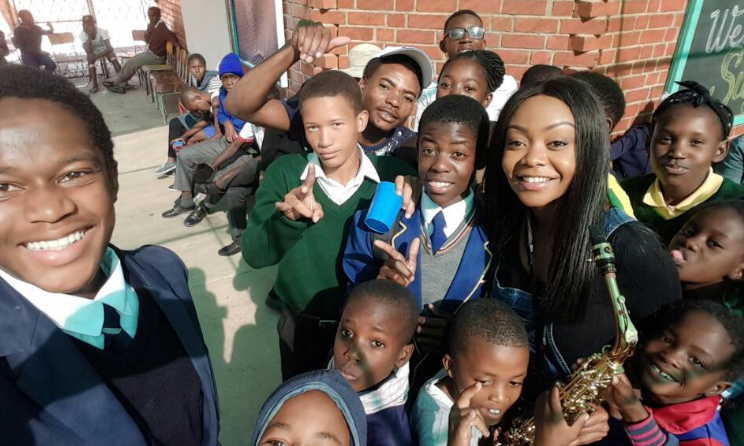 Namibian saxophonist Suzy Eises with PAY kids in the Katutura township in Windhoek.