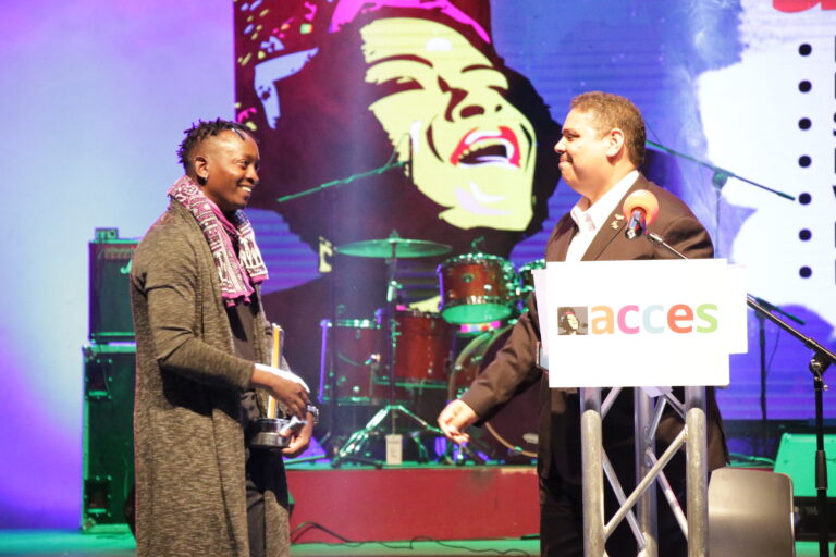 Eric Wainaina greets Andre Le Roux upon receiving the 2018 Music In Africa Honorary Award at the Kenya National Theatre on Thursday night. Photo: Music In Africa