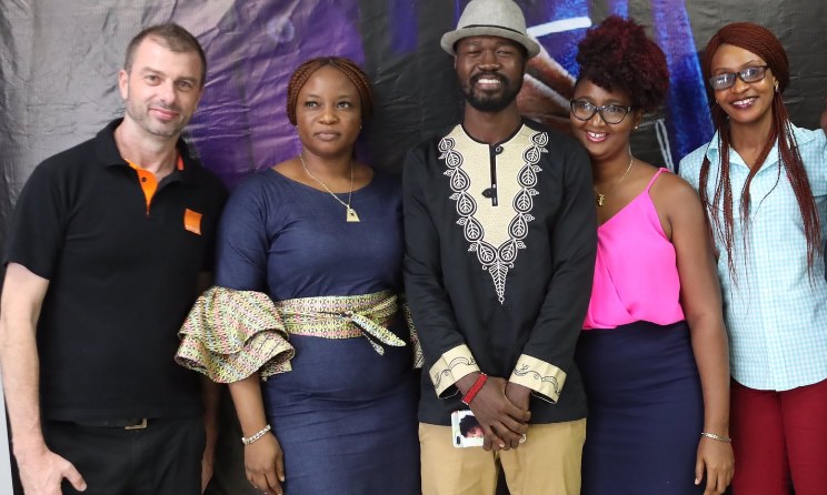 Noel Chateau, left, and Lyee Bility, middle, at the Orange Talents launch.
