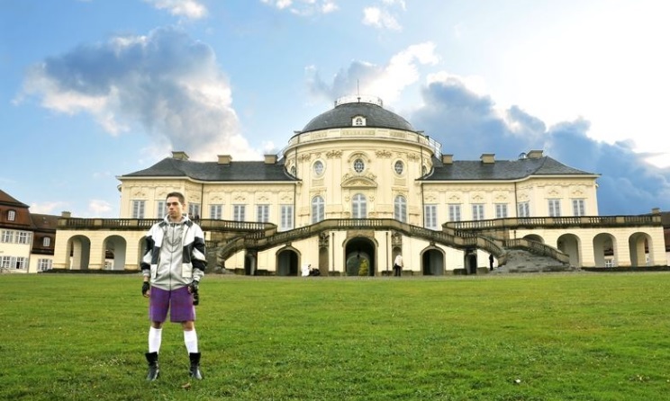Artist Ivan Civic posing in front of Castle Solitude.