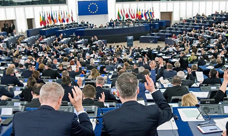 European Parliament members voting.