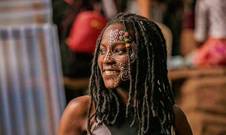 A festivalgoer shows off her face art at a previous Nyege Nyege festival . Photo: Zahara Abdul