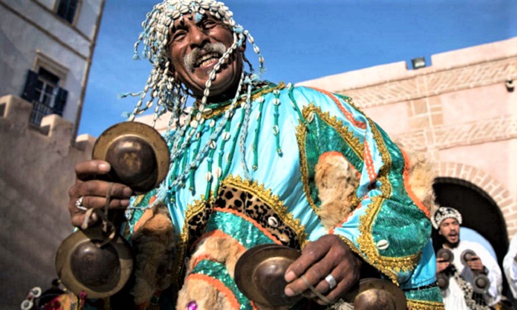 A Gnawa musician playing the krakebs.