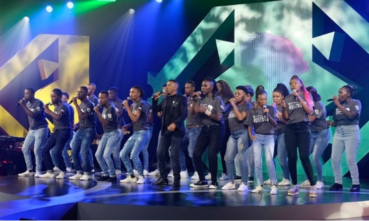 Zwai Bala performs with finalists at Season 1 of the Old Mutual Amazing Voices music competition.