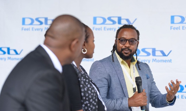 Colin Asiimwe speaking during the launch of Radio One FM 90 on DStv.