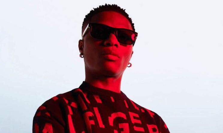 A Pass the Mic campaign image featuring Wizkid.