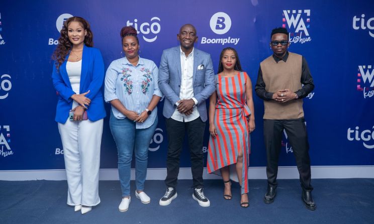 Representatives from Boomplay and Tigo pose for a photograph at the announcement of the partnership.