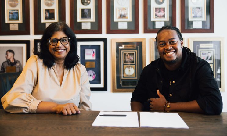 Universal Music Group managing director Manusha Sarawan and jazz saxophonist Linda Sikhakhane during the signing of the musician’s deal with the major label.