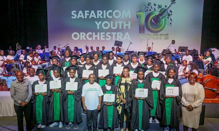 The Safaricom Youth Orchestra Class of 2024 pose with their tutors and Safaricom staff at the Woodcreek School auditorium in Nairobi on 24 March.