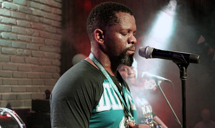 ANCESTRAL HEALING: Nkosi ‘Jovi’ Zithulele during one of his more introspective onstage moments and Kgomotso Mokone in the background. Photo: Kalin Pashaliev