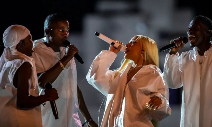 Doja Cat performing with South African a capella group The Joy at the 2024 Coachella Festival in California on 14 April.