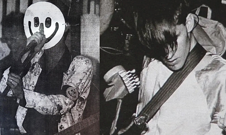 Live Jimi Presley in the 1990s. On the left Marc Feltham wearing a smiley-face mask and on the right the band’s bassist, Derek Davey.