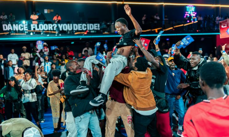 Samuel Brian is hoisted high after winning the Red Bull Dance Your Style Kenya competition at SK8city in Nairobi on 10 August 2024.