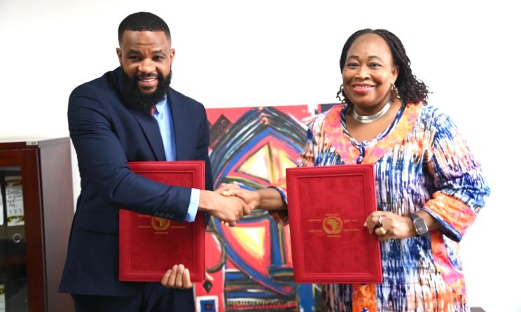 Music In Africa Executive Director Eddie Hatitye and AU Commissioner H.E Amb. Minata Samate Cessouma shake hands after signing a landmark agreement.